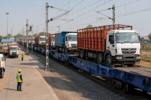 Trucks-on-Trains multimodal service carrying loaded trucks through a modern Indian freight terminal